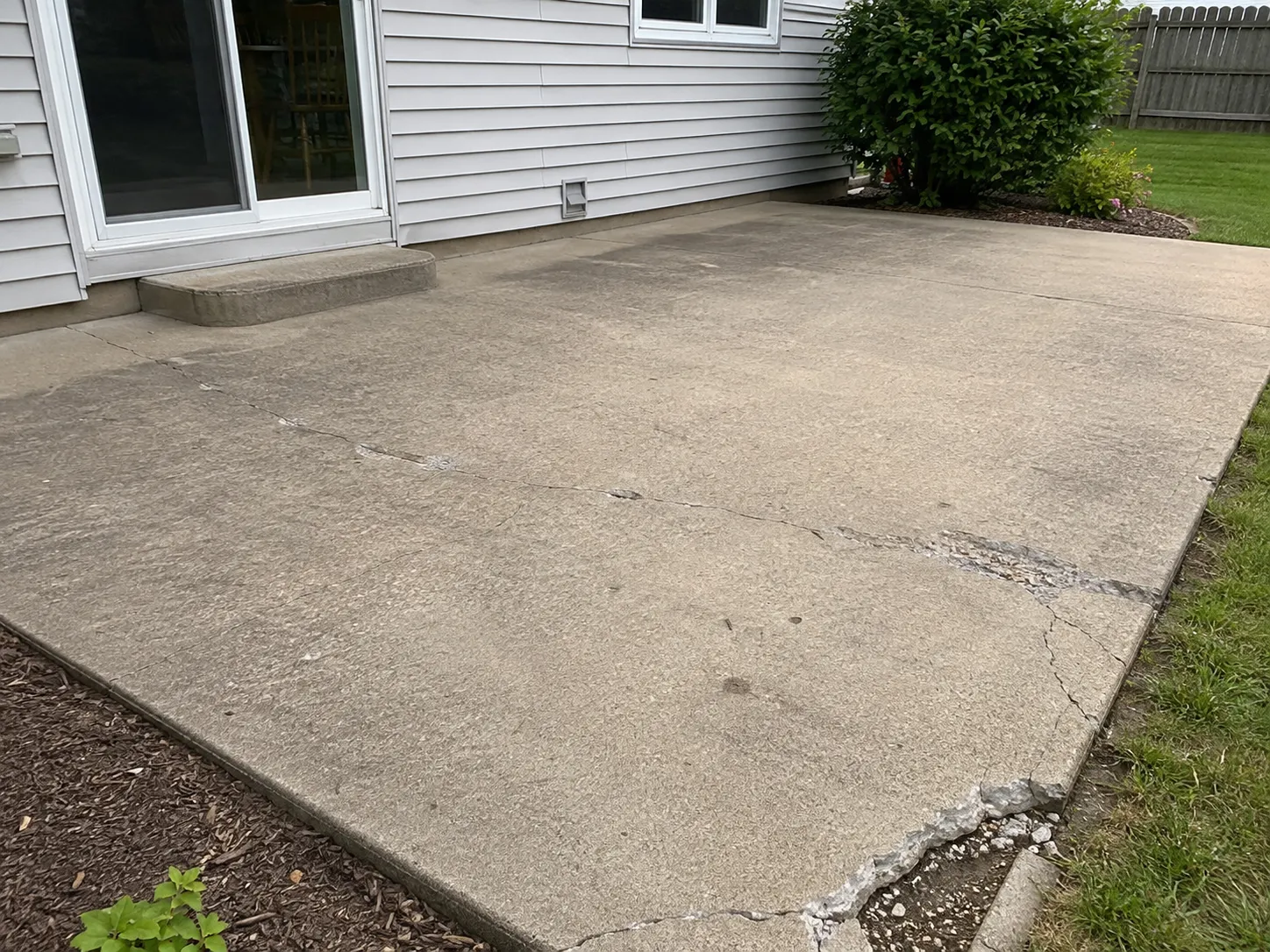 Damaged concrete patio before repair