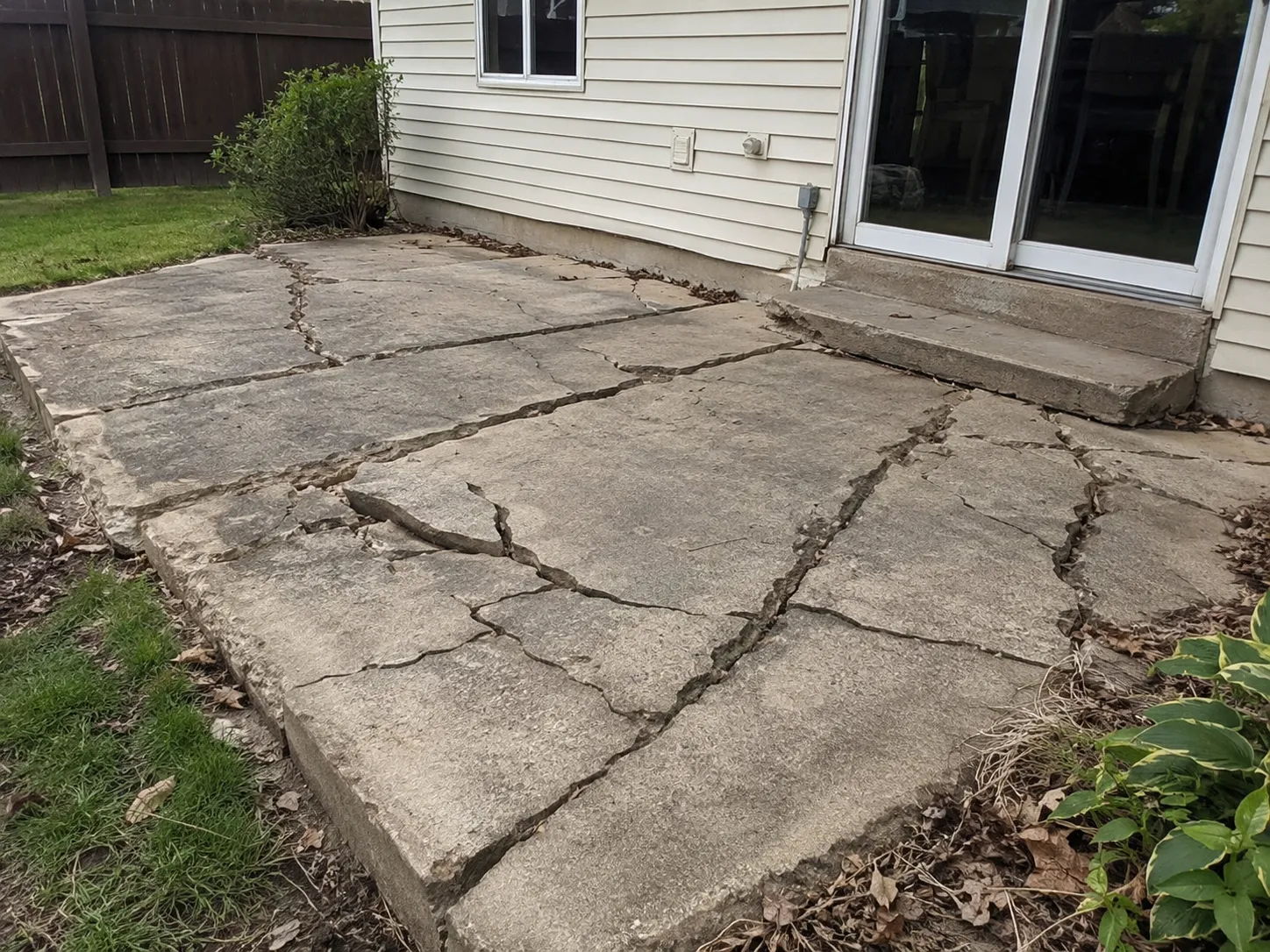 Damaged concrete patio before replacement